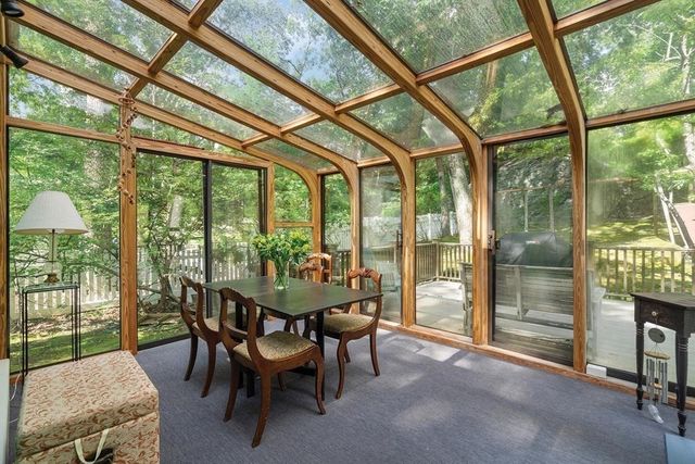 a view of a room with a table and chairs