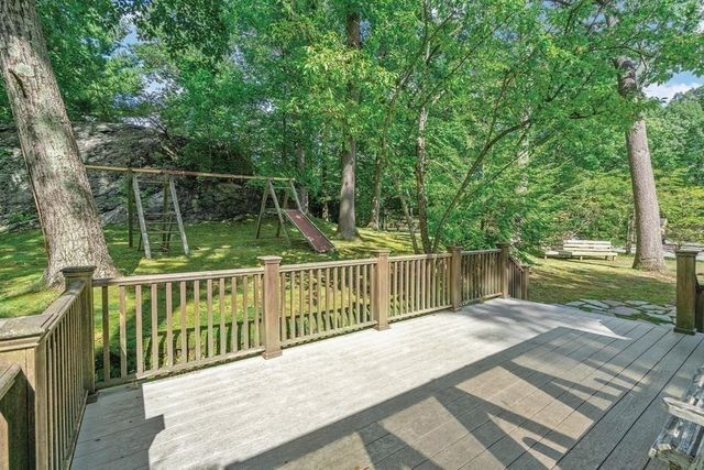 a view of balcony with wooden floor