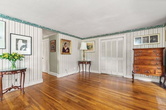 a view of a livingroom with furniture and wooden floor