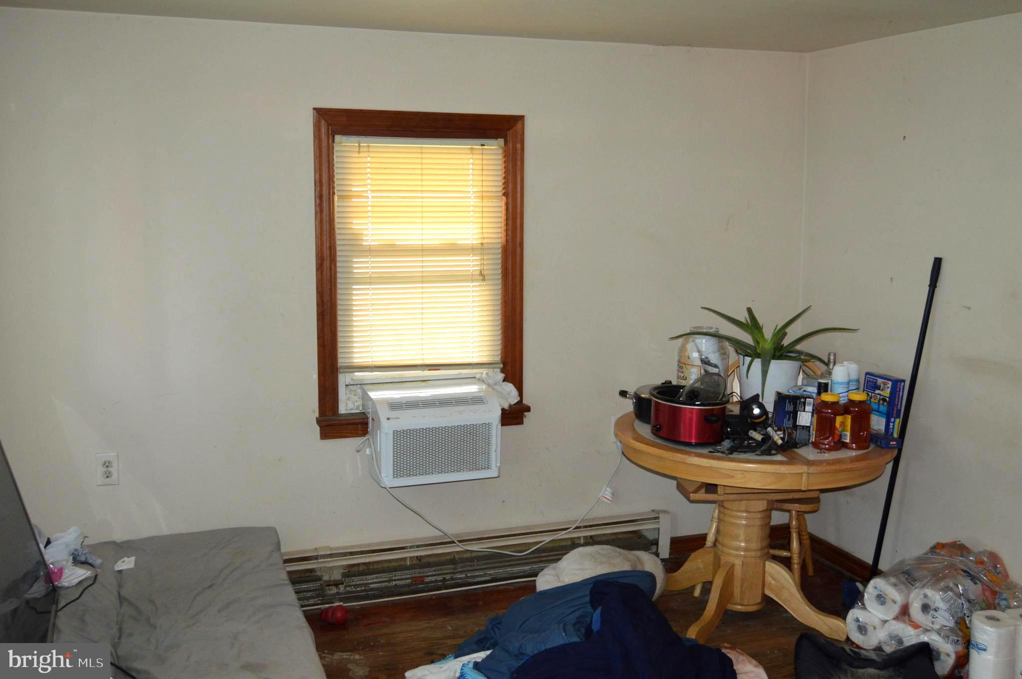 46 Mountain Spring Road Blandon, PA 19510 - Photo 8 of 18 a room with furniture and a potted plant