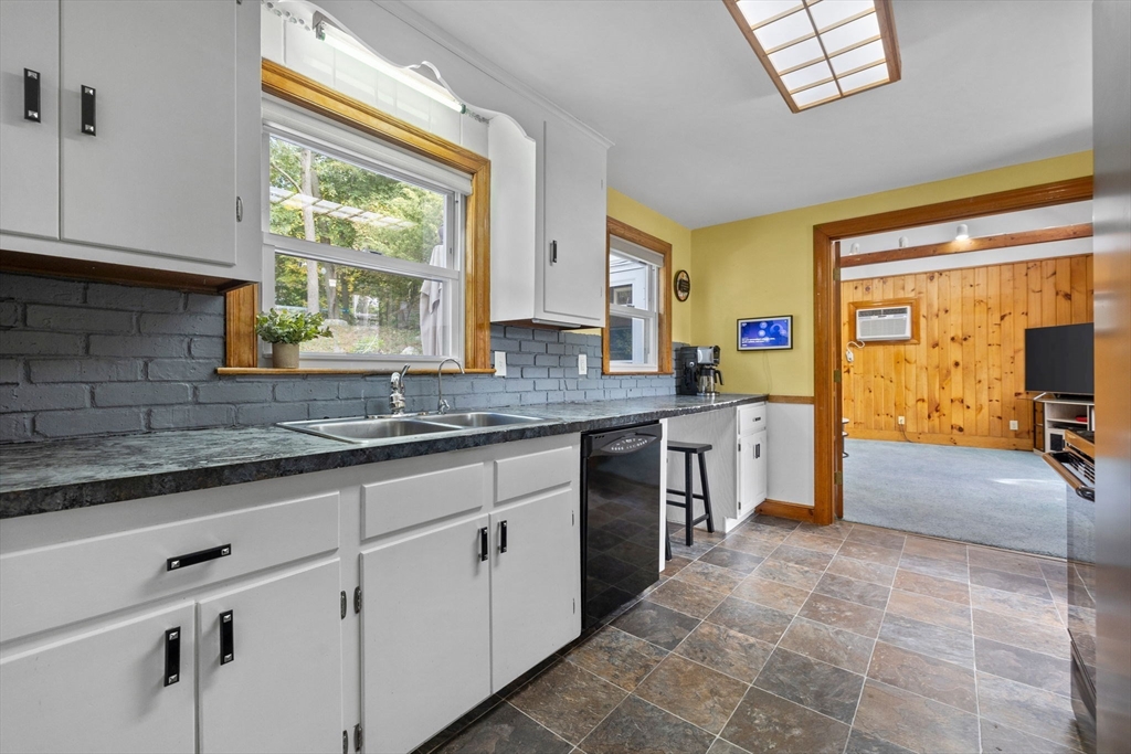 17 Spring Street Wakefield, MA 01880 - Photo 8 of 31 a kitchen with stainless steel appliances granite countertop a sink and a stove