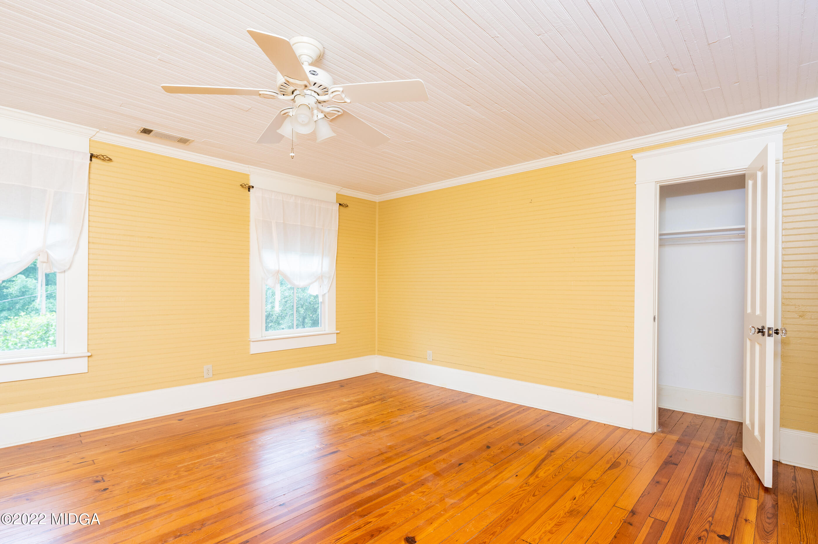 117 Moore Road Gray, GA 31032 - Photo 35 of 85 a view of an empty room with wooden floor and a window