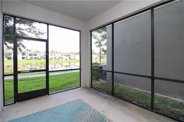 a view of a porch with a floor to ceiling window
