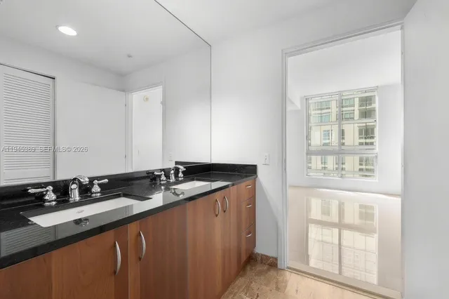 a bathroom with a shower curtain and a sink