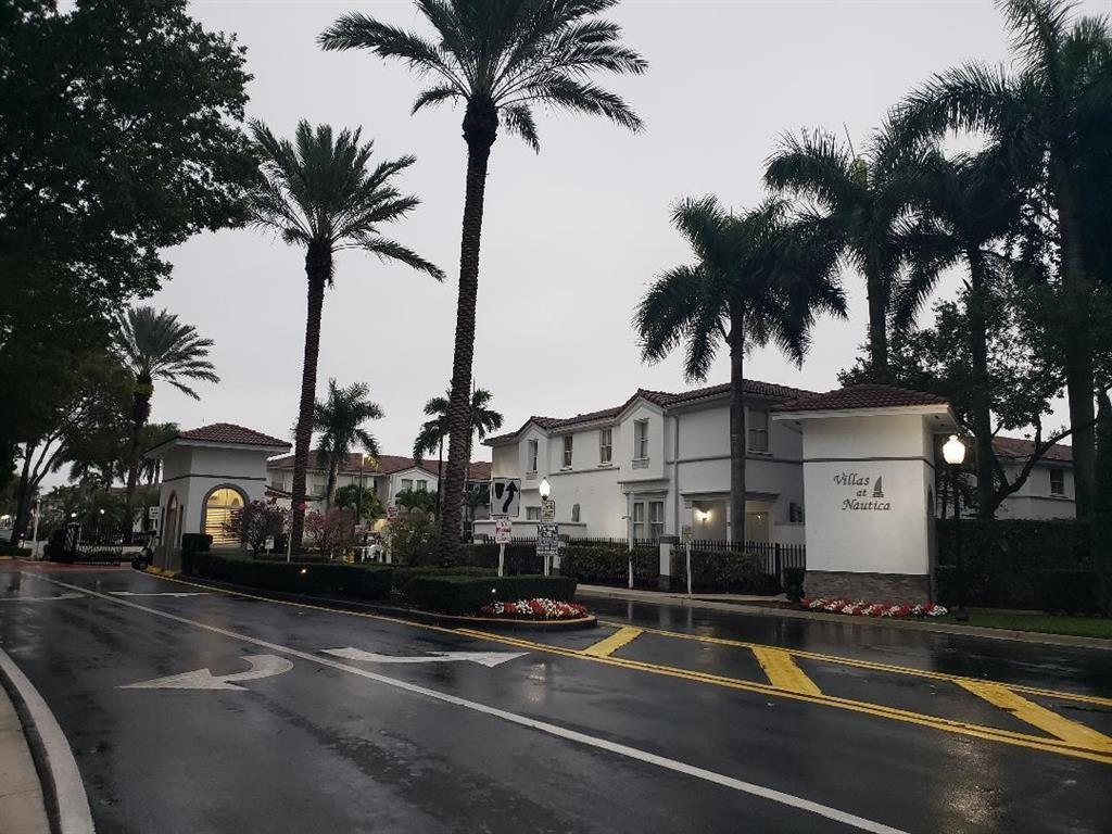 a view of a building with palm trees