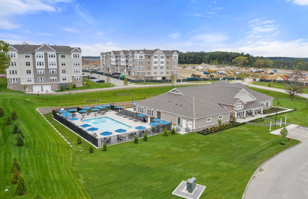 2 Codman Way, Unit 207 Westborough, MA 01581 - Photo 29 of 40 a aerial view of a residential apartment building with a yard