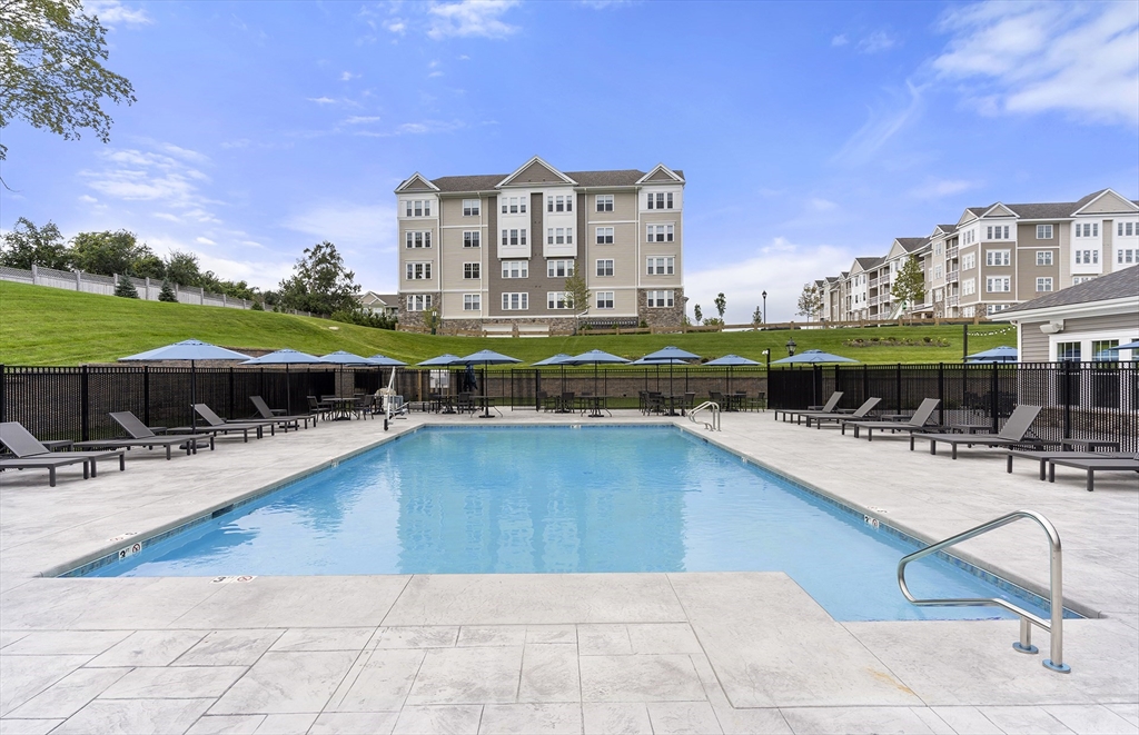 2 Codman Way, Unit 207 Westborough, MA 01581 - Photo 33 of 40 a view of a swimming pool with outdoor seating