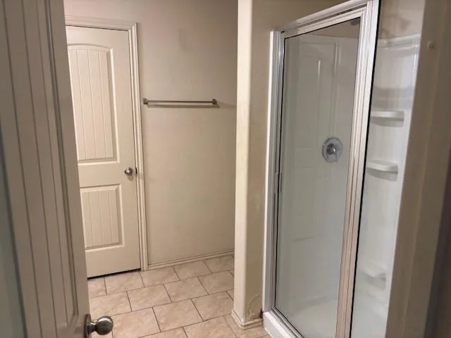a bathroom with a double vanity sink and mirror