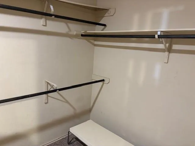 a kitchen with stainless steel appliances granite countertop a refrigerator and a stove