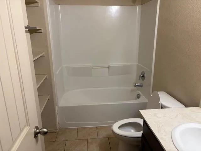 a kitchen with stainless steel appliances granite countertop a sink and a stove