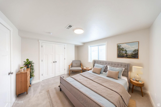 2169 Orchard Pines Loop East Bountiful, UT 84010 - Photo 18 of 32 Carpeted room featuring a white interior door, a double-door closet with paneling, a window with blinds, and recessed lighting