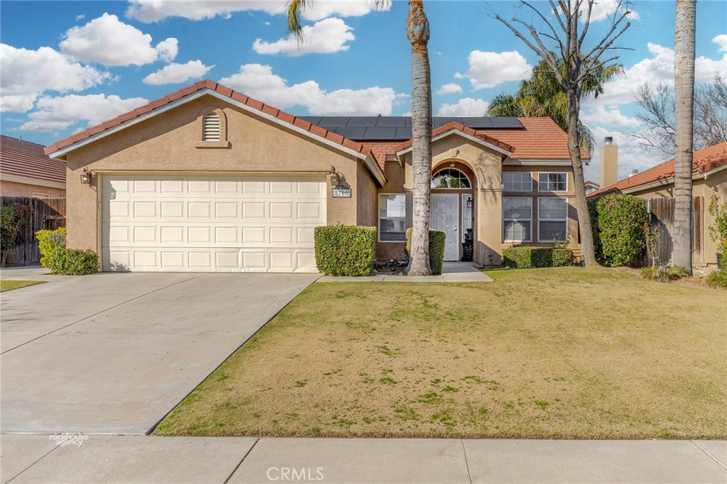 8700 Rollingbay Drive Bakersfield, CA 93312 - Photo 1 of 36 a front view of a house with a yard