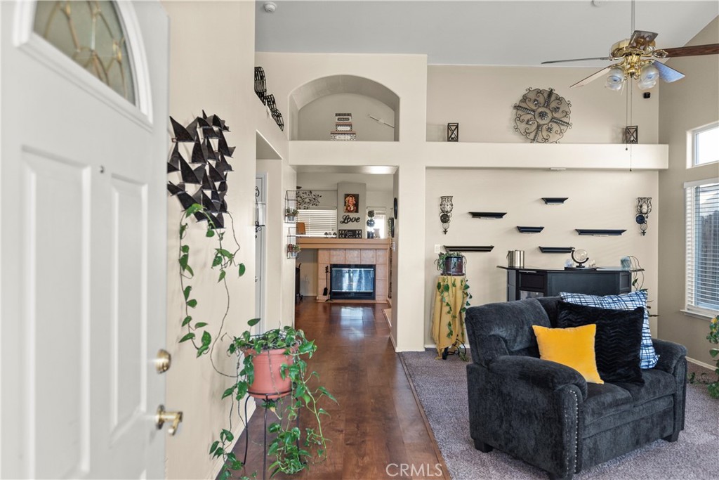 8700 Rollingbay Drive Bakersfield, CA 93312 - Photo 3 of 36 a living room with furniture and wooden floor