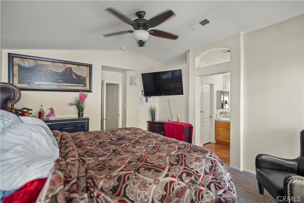 8700 Rollingbay Drive Bakersfield, CA 93312 - Photo 31 of 36 a bedroom with a bed and a flat screen tv