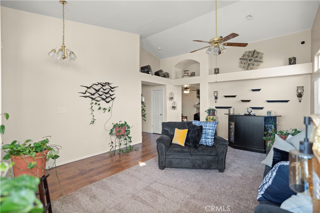 8700 Rollingbay Drive Bakersfield, CA 93312 - Photo 8 of 36 a living room with furniture and flowers