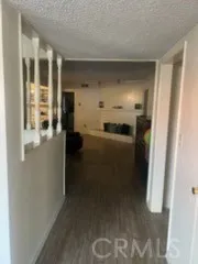 a view of a kitchen from the hallway