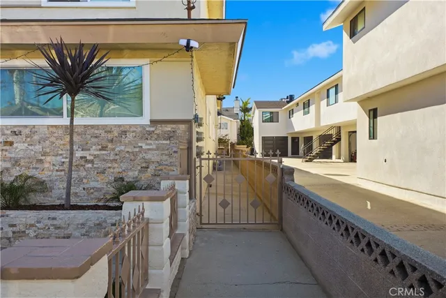 a view of balcony with small garden and outdoor seating
