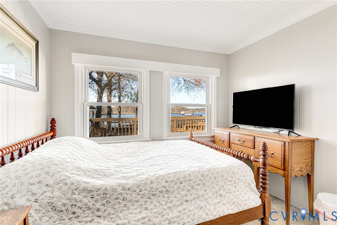 700 West Riverside Drive Lanexa, VA 23089 - Photo 12 of 44 a bedroom with a bed and a flat screen tv