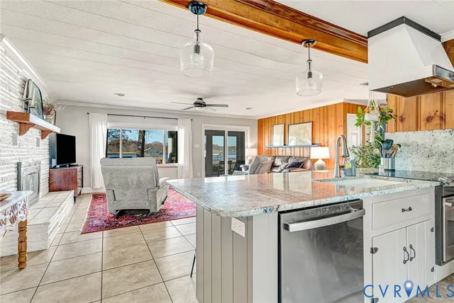 a kitchen with stainless steel appliances granite countertop a stove and cabinets
