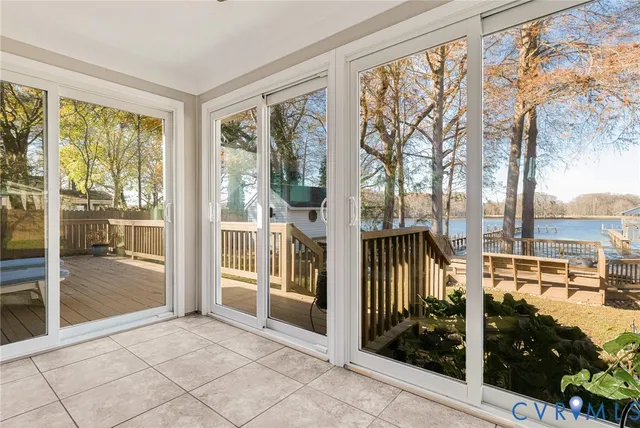 a view of a living room and a balcony