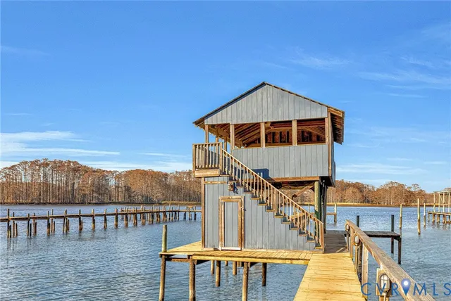 a roof deck with table and chairs