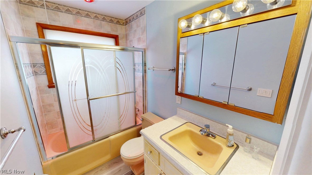 6904 Center Road Valley City, OH 44280 - Photo 19 of 36 Full bathroom featuring vanity and combined bath / shower with glass door