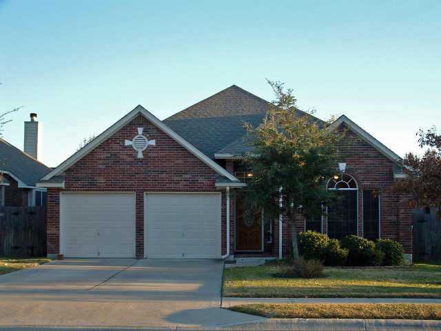 13213 Armaga Springs Road Austin, TX 78727 - Photo 1 of 1 front view of a house with a yard