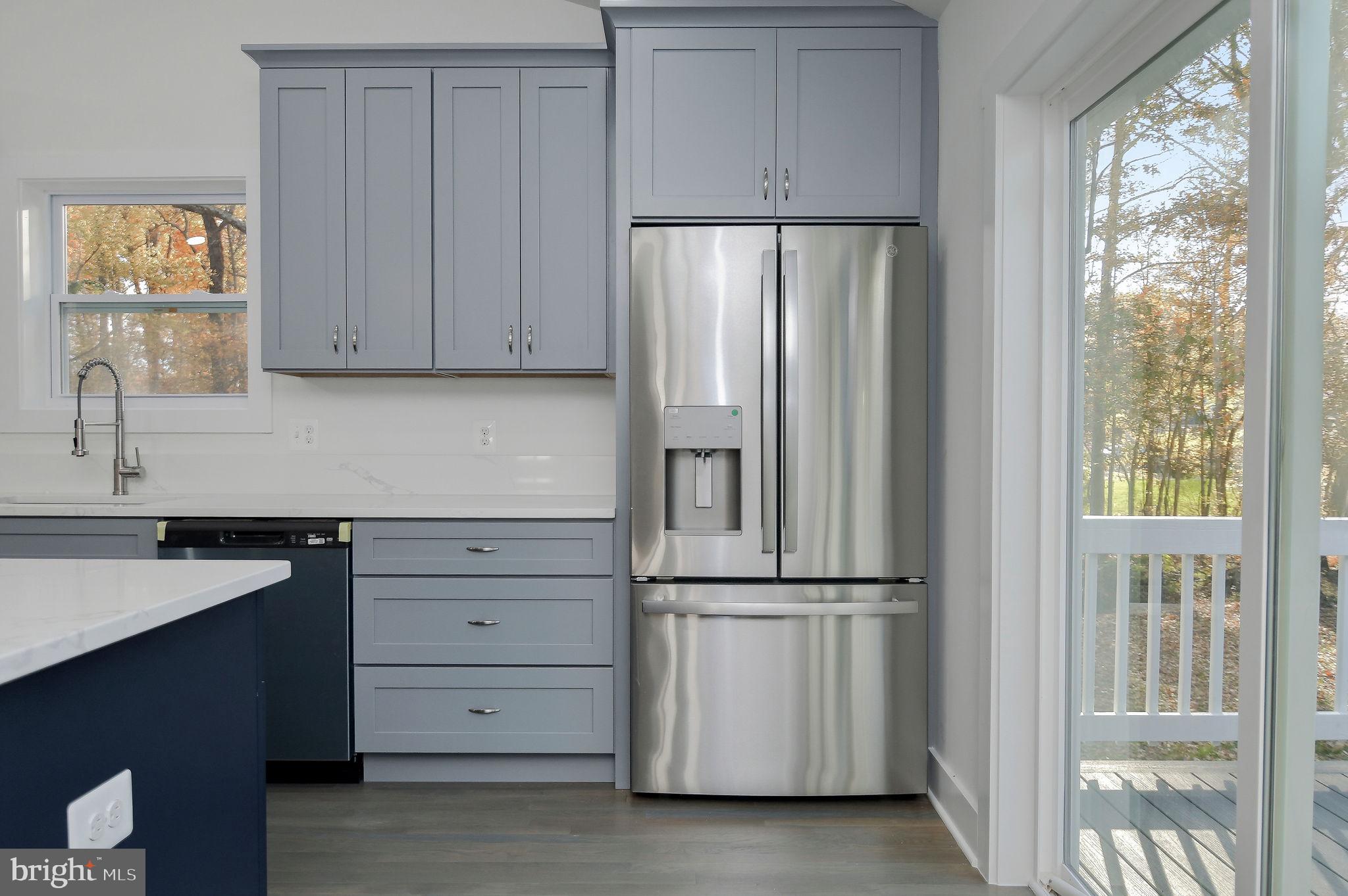 2016 Spring Grove Drive Accokeek, MD 20607 - Photo 12 of 36 a kitchen with cabinets and a refrigerator