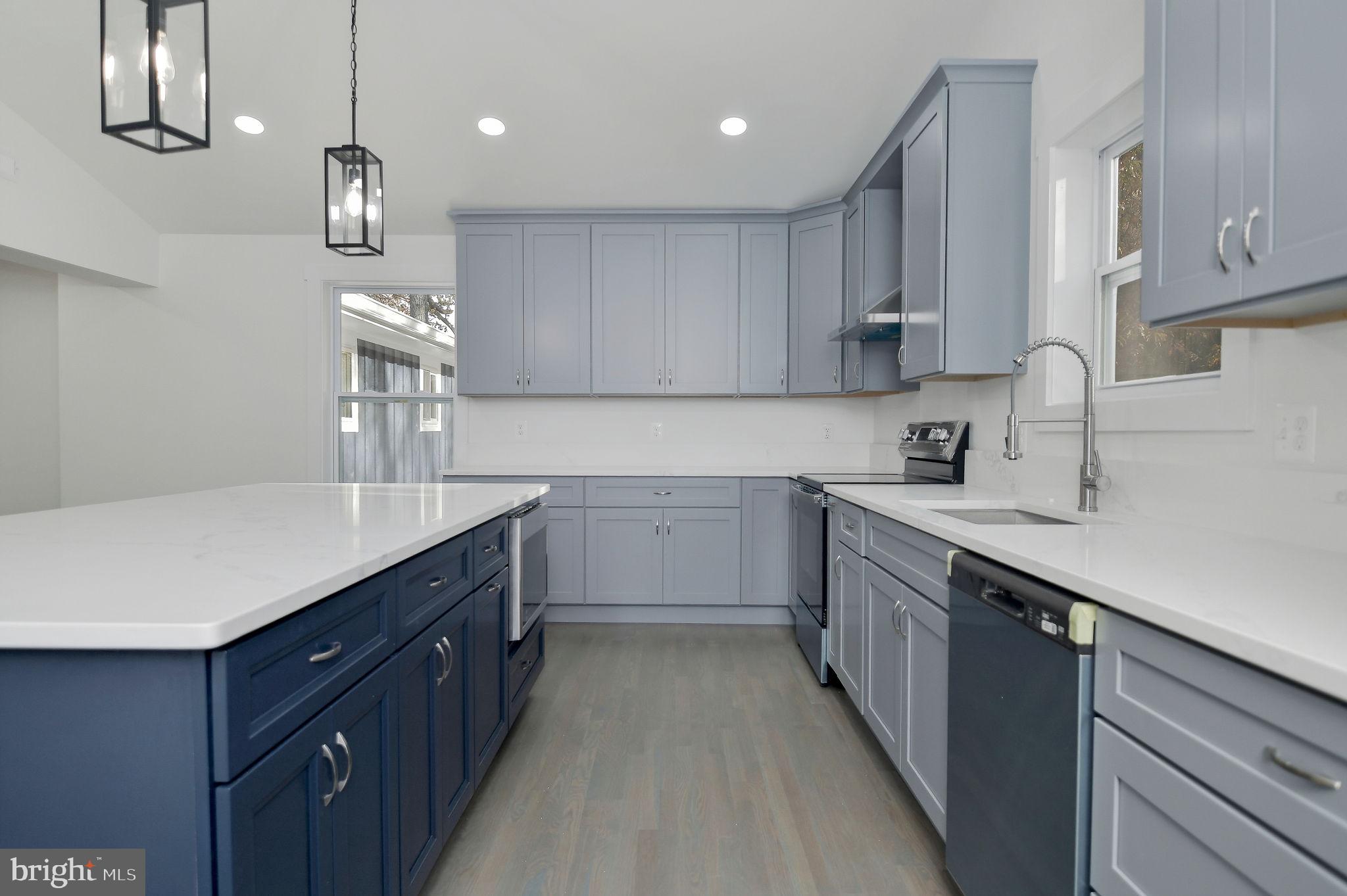 2016 Spring Grove Drive Accokeek, MD 20607 - Photo 13 of 36 a kitchen with kitchen island granite countertop a sink and cabinets