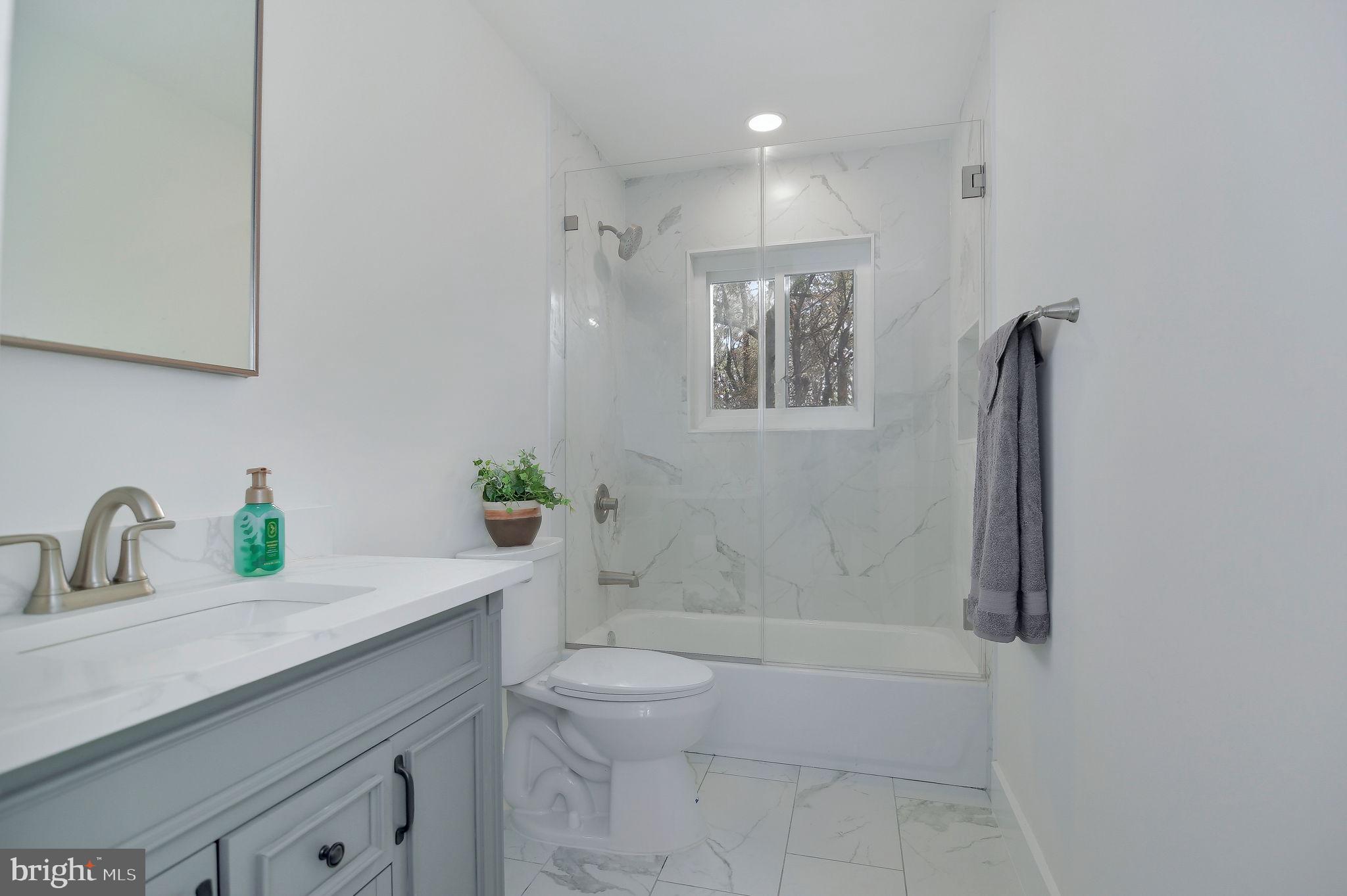 2016 Spring Grove Drive Accokeek, MD 20607 - Photo 15 of 36 a bathroom with a granite countertop sink a toilet and shower