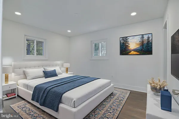 a bedroom with a large bed and a couch