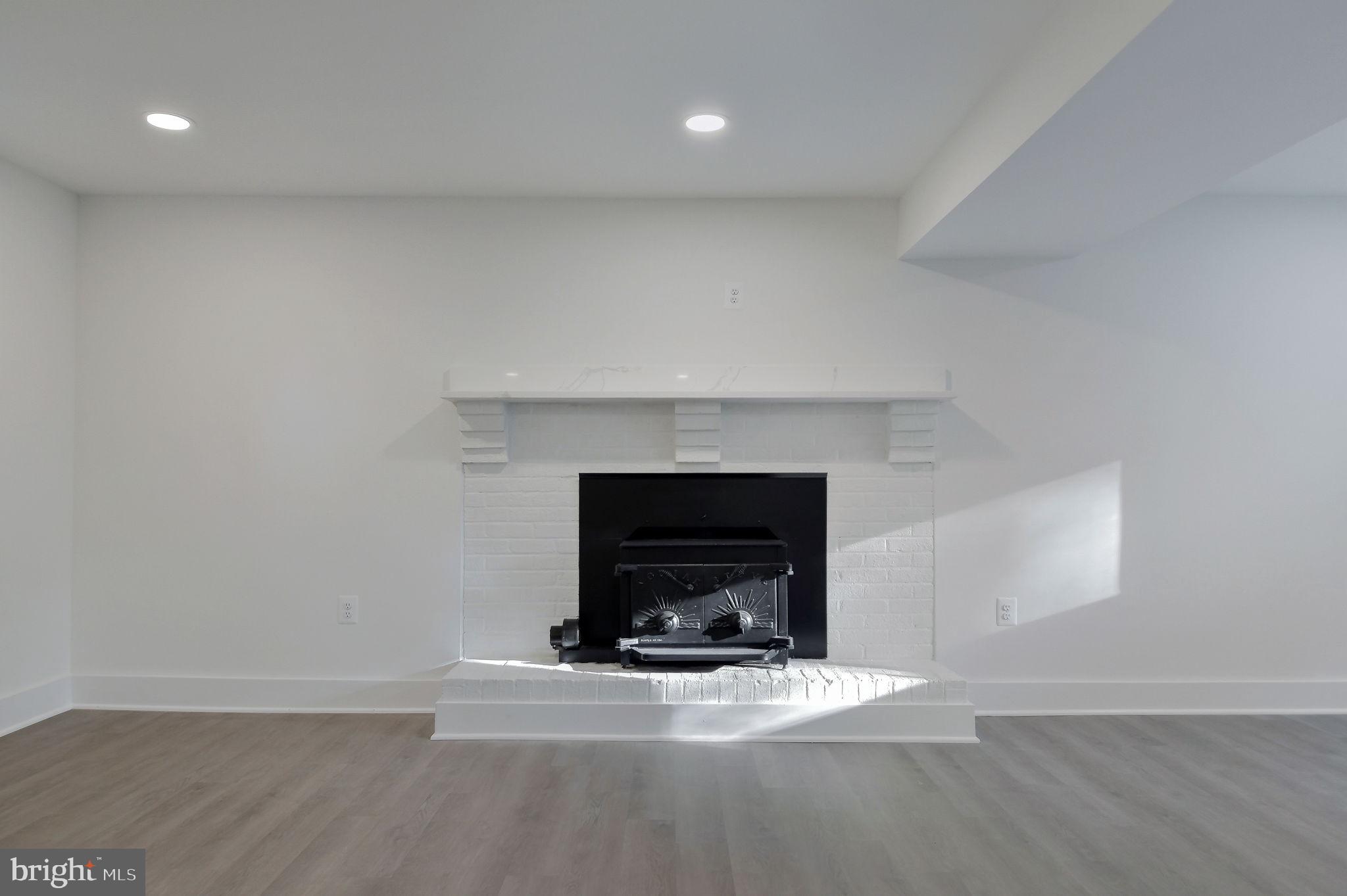 2016 Spring Grove Drive Accokeek, MD 20607 - Photo 21 of 36 a living room with a fireplace and a fireplace