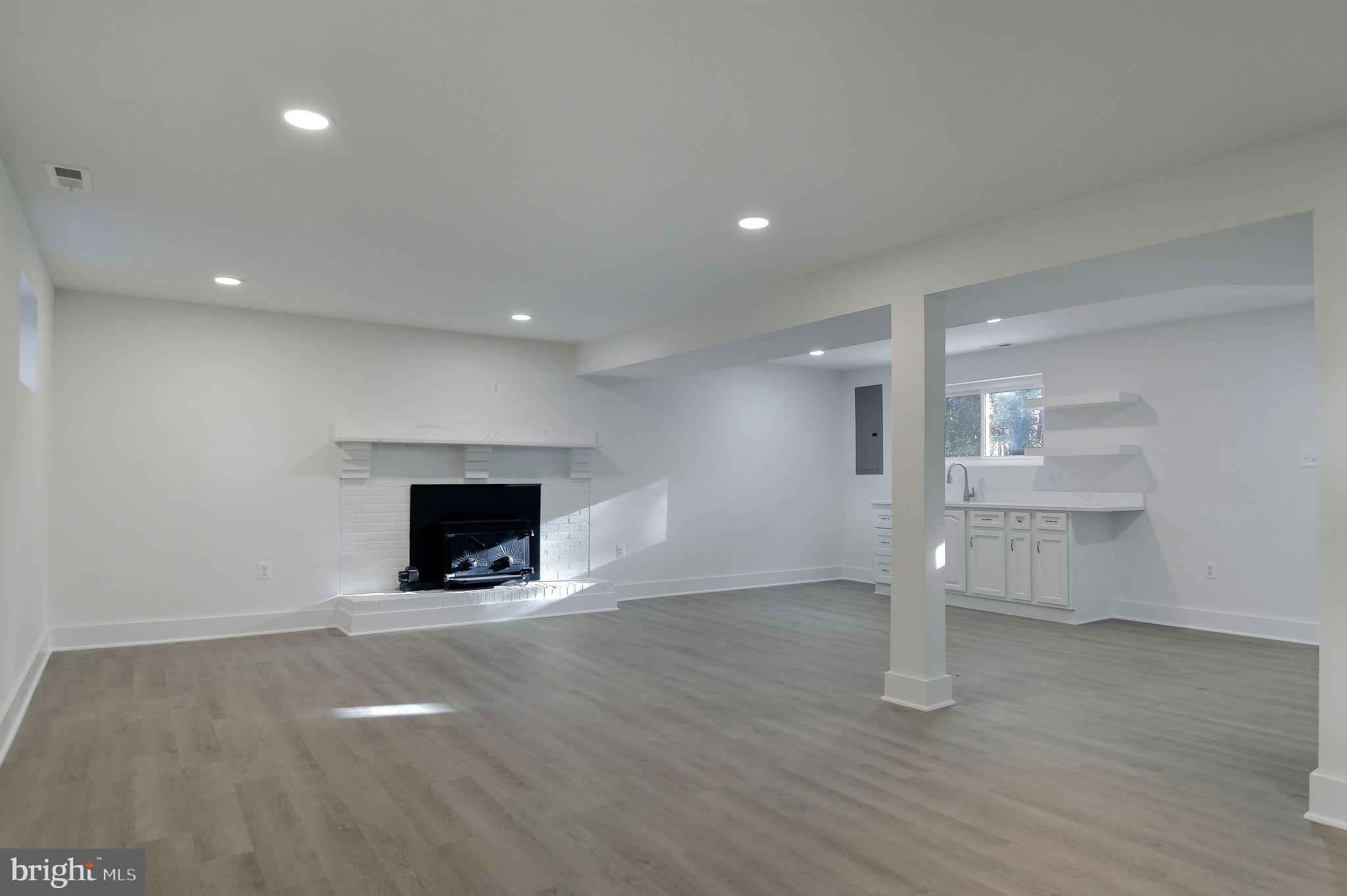 2016 Spring Grove Drive Accokeek, MD 20607 - Photo 22 of 36 a view of an empty room with a fireplace and a window