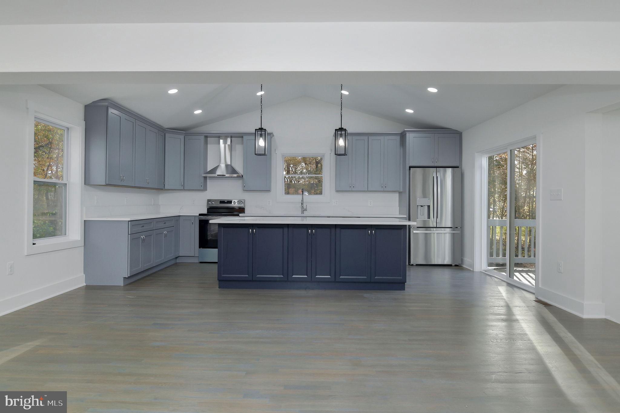 2016 Spring Grove Drive Accokeek, MD 20607 - Photo 10 of 36 a large kitchen with kitchen island granite countertop a large counter top and stainless steel appliances