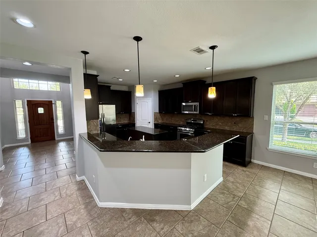 a bathroom with a sink a toilet and a bathtub
