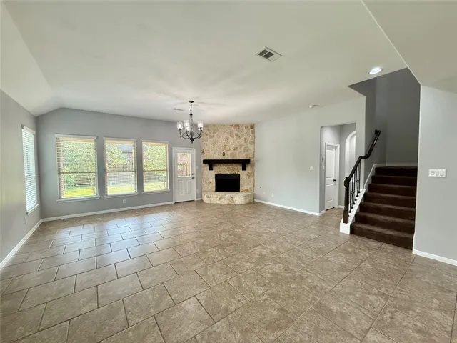 a bathroom with a granite countertop sink toilet a mirror and vanity