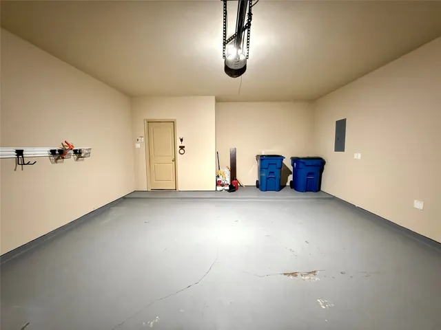 a front view of a house with a yard and tree