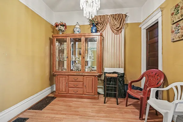 a bedroom with a bed and a chair