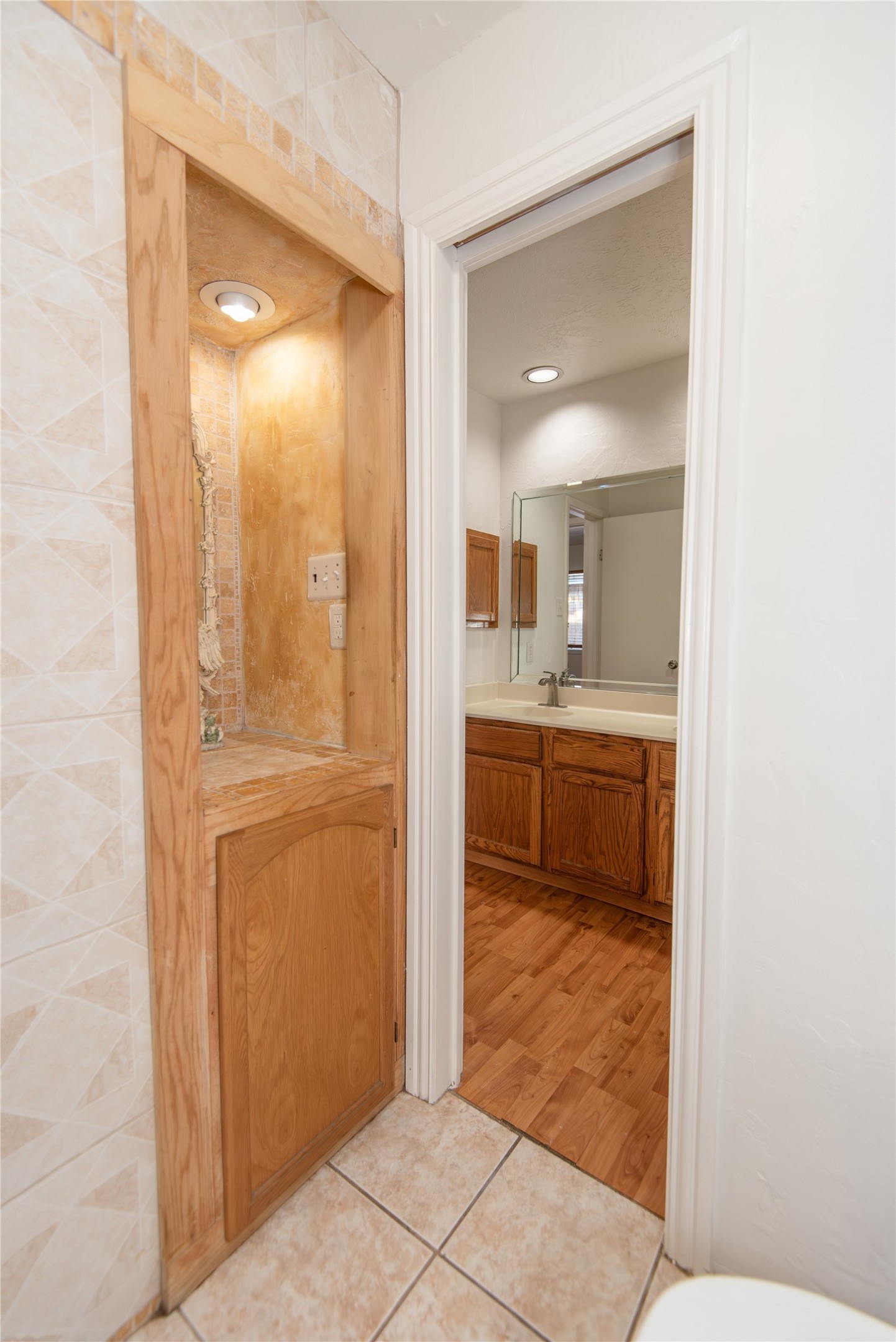21734 Nickerton Lane Spring, TX 77388 - Photo 24 of 31 a bathroom with a sink a mirror and a shower