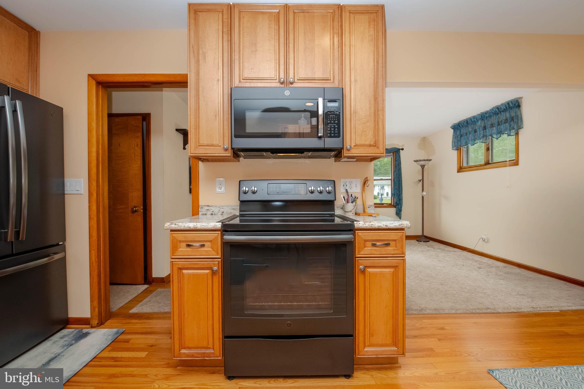 2319 Reckord Road Joppa, MD 21085 - Photo 12 of 45 a kitchen with a stove and a microwave