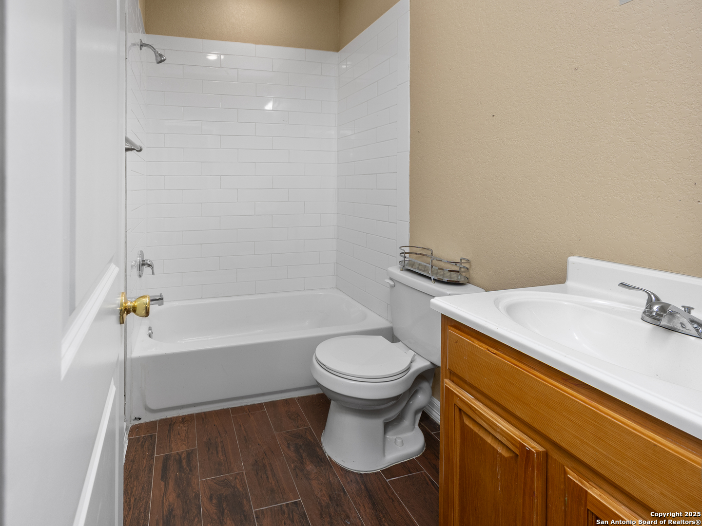 104 Viewpoint Drive Poteet, TX 78065 - Photo 12 of 23 a bathroom with a sink a toilet and a bathtub