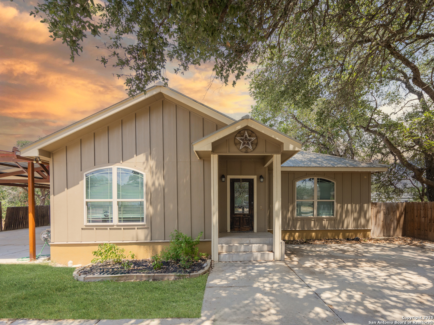 104 Viewpoint Drive Poteet, TX 78065 - Photo 23 of 23 a front view of a house with a yard and porch