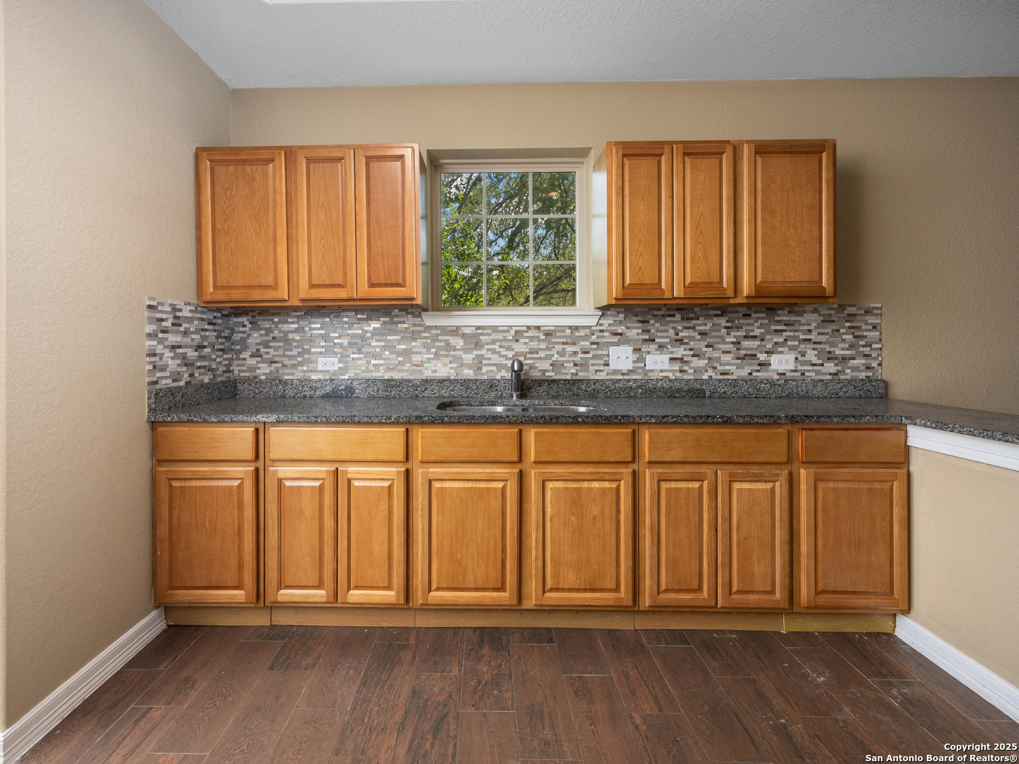 104 Viewpoint Drive Poteet, TX 78065 - Photo 9 of 23 an empty room with wooden floor