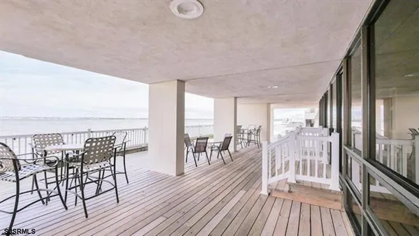 a view of a balcony with chairs