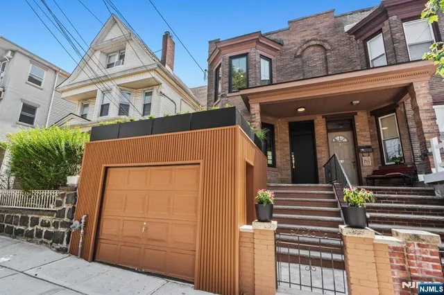 a view of a building with entryway and stairs