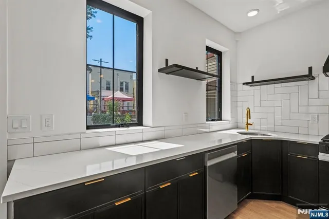 a kitchen with a sink and a window