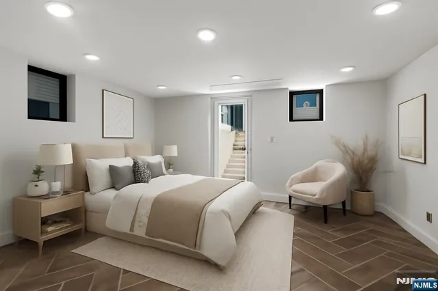 a bedroom with a bed and a chair