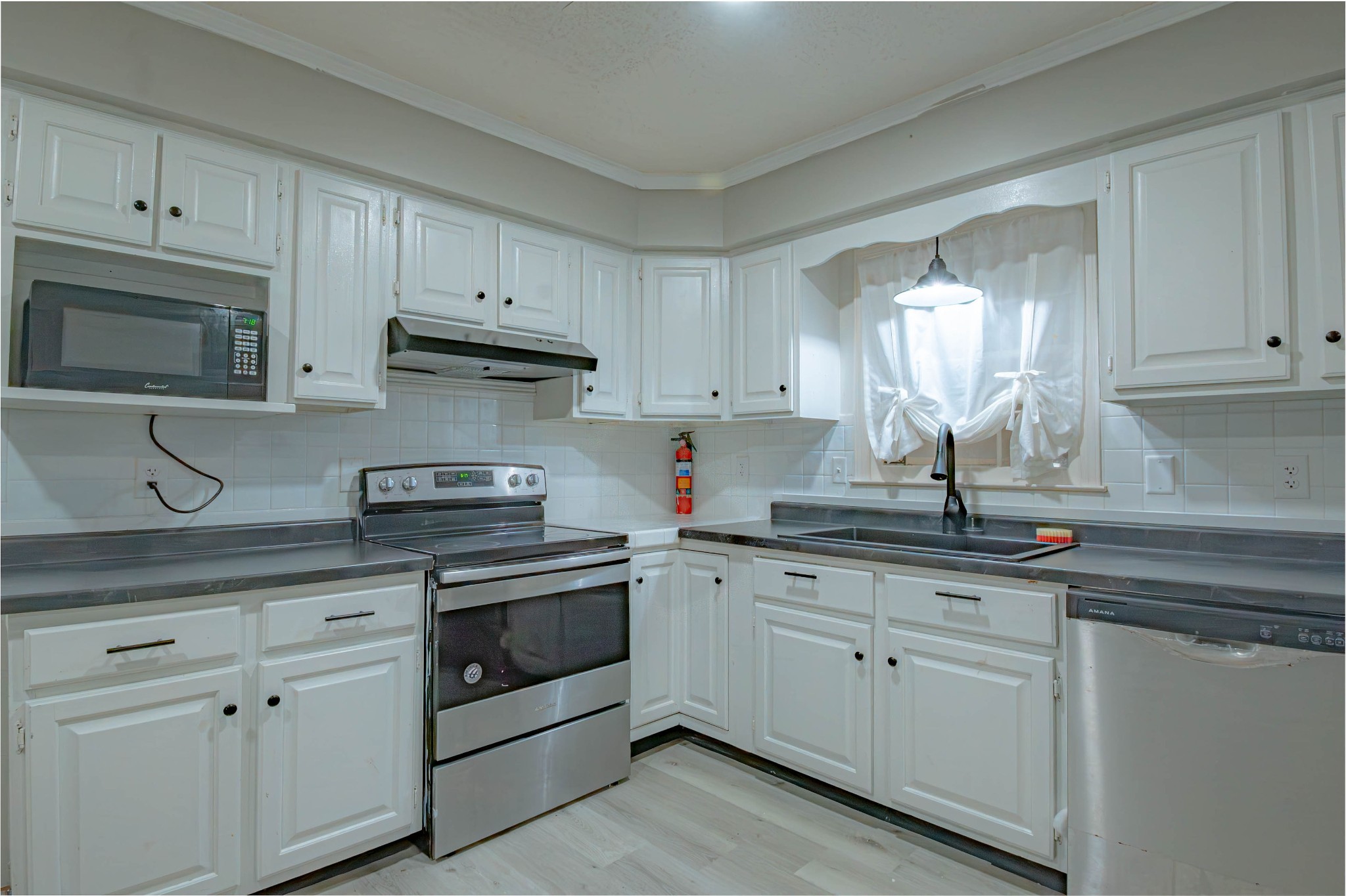 674 Girkin Road Bowling Green, KY 42101 - Photo 21 of 50 a kitchen with granite countertop white cabinets white stainless steel appliances and a sink