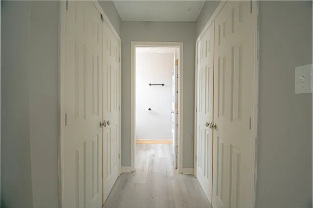 a view of a bathroom from the hallway