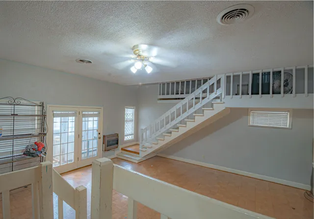 a view of hall way with furniture